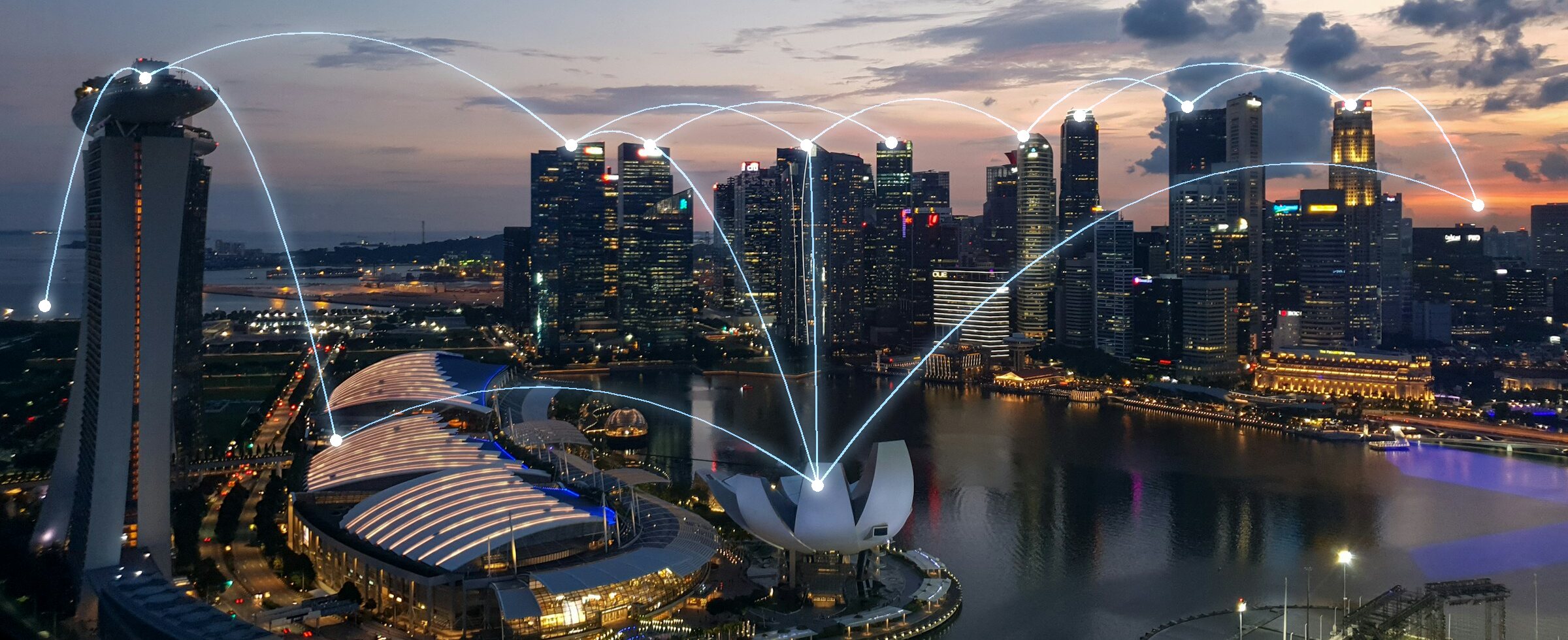 Singapore skyline at dusk over Marina Bay, with connected-city network lines linking the towers